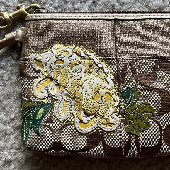 Coach wristlet with gold and flower accent - Picture 3 of 7